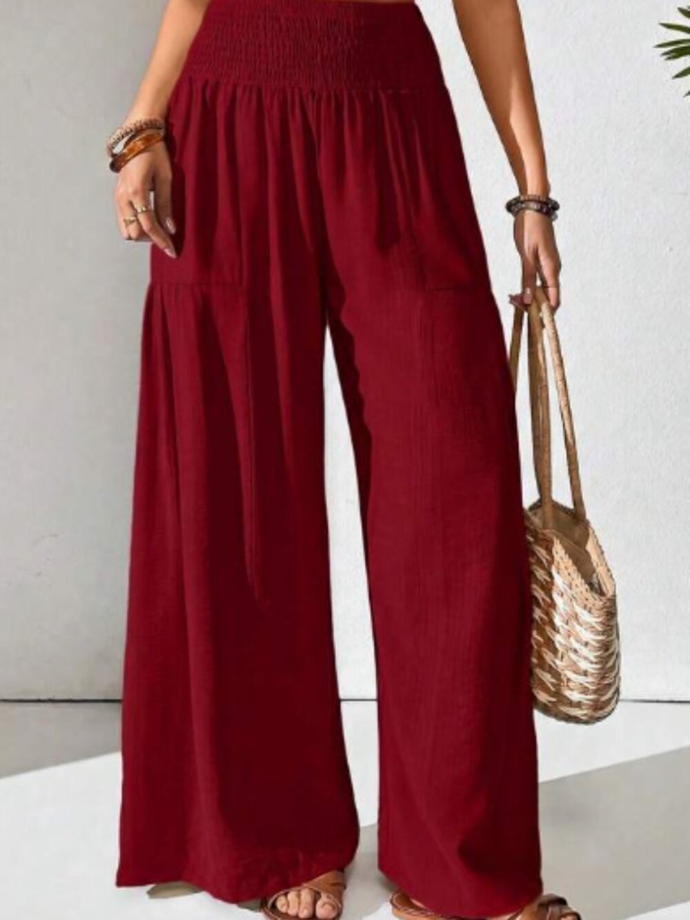 Tired wide leg palazzo pants featuring comfortable elastic high waist